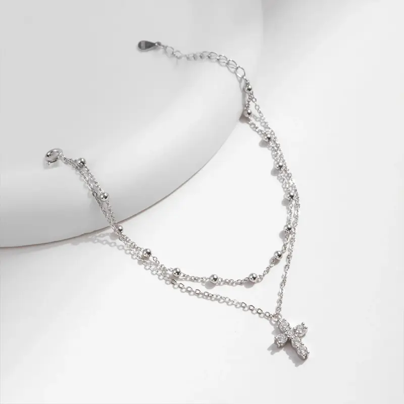Silberfarbenes Moissanit Armband mit Verlängerungskette und Kreuzanhänger
