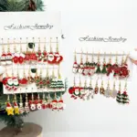 Zwei Schmuckkarten des 25-Paare-Weihnachtssets mit Schneemann, Zuckerstange, Glocke, Rentier und Lebkuchenmann