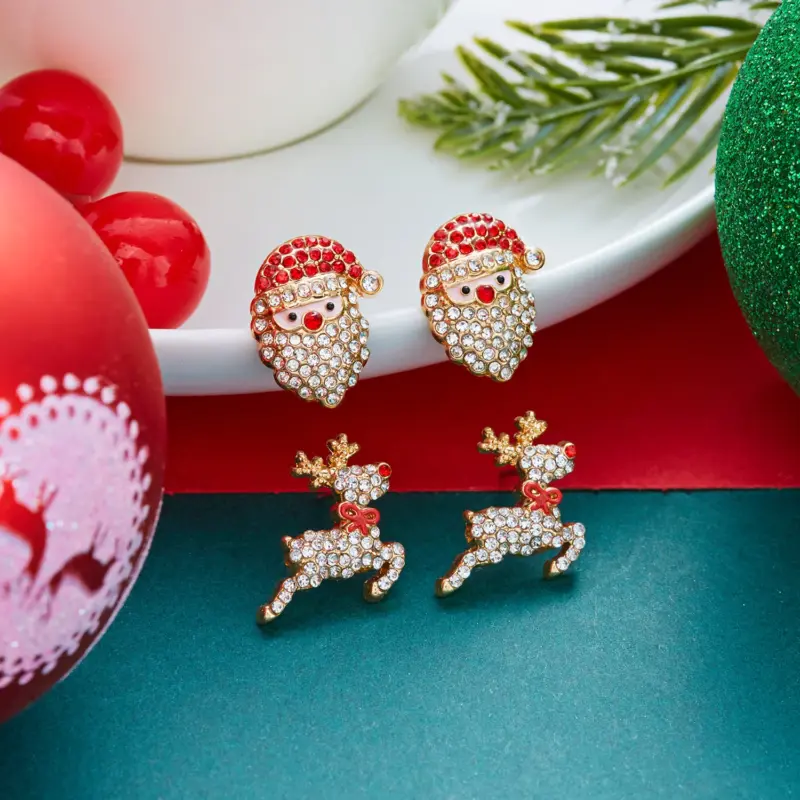 Glitzernde Weihnachtsmann- und Rentier-Ohrstecker mit roten und klaren Schmucksteinen