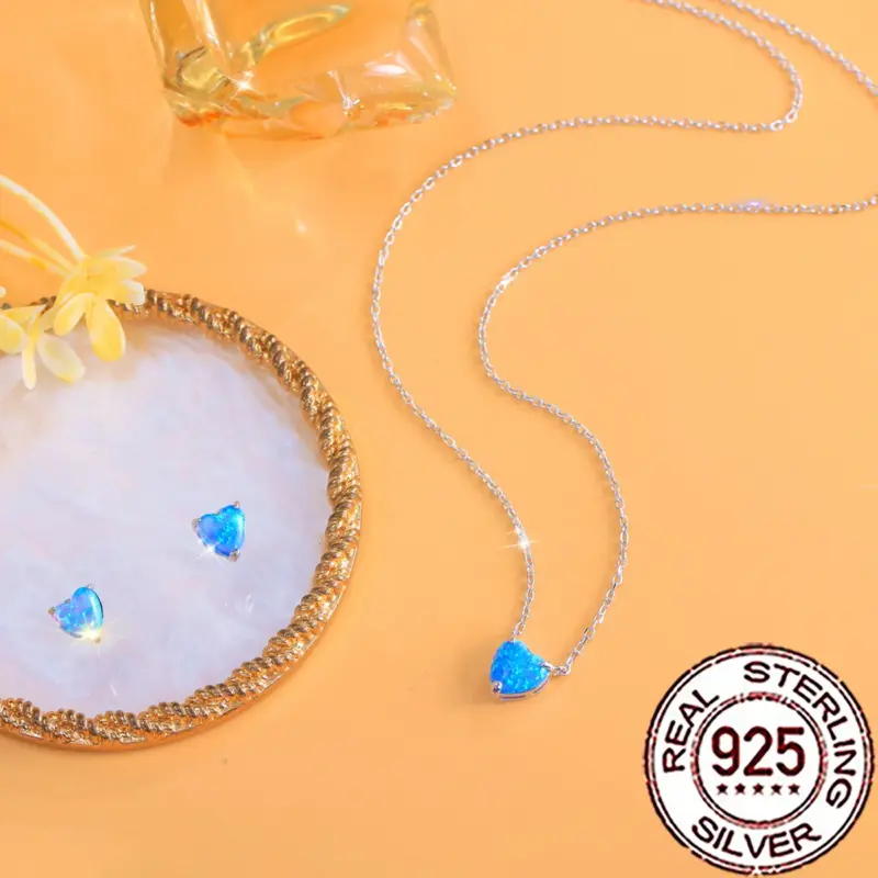 QooLady Schmuckset Damen – silberfarbener Herzschmuck mit blauem Stein-Look