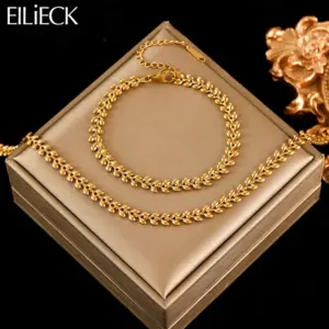 EILIECK goldfarbenes Schmuckset mit Blattglieder-Halskette und passendem Armband auf Schmuckunterlage